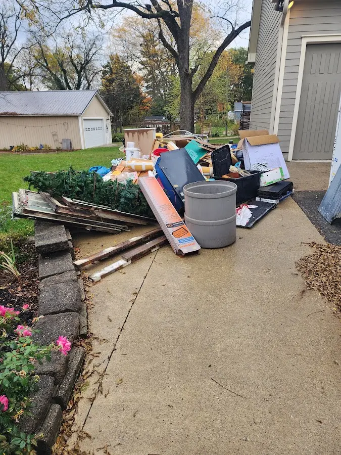 Dumpster being loaded with debris for 3 Yard Dumpster Rental in Breese